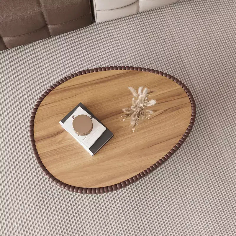 Table basse en cuir en forme d'œuf d'oie avec plateau en pierre sintérisée et motif unique